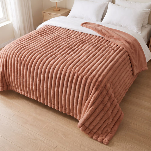 clay colored blanket on a bed