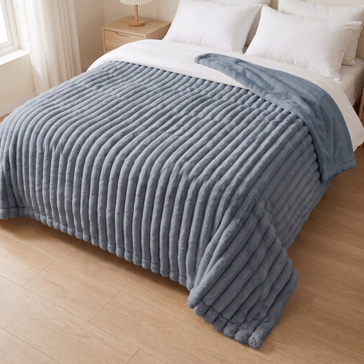 slate blue blanket on a bed