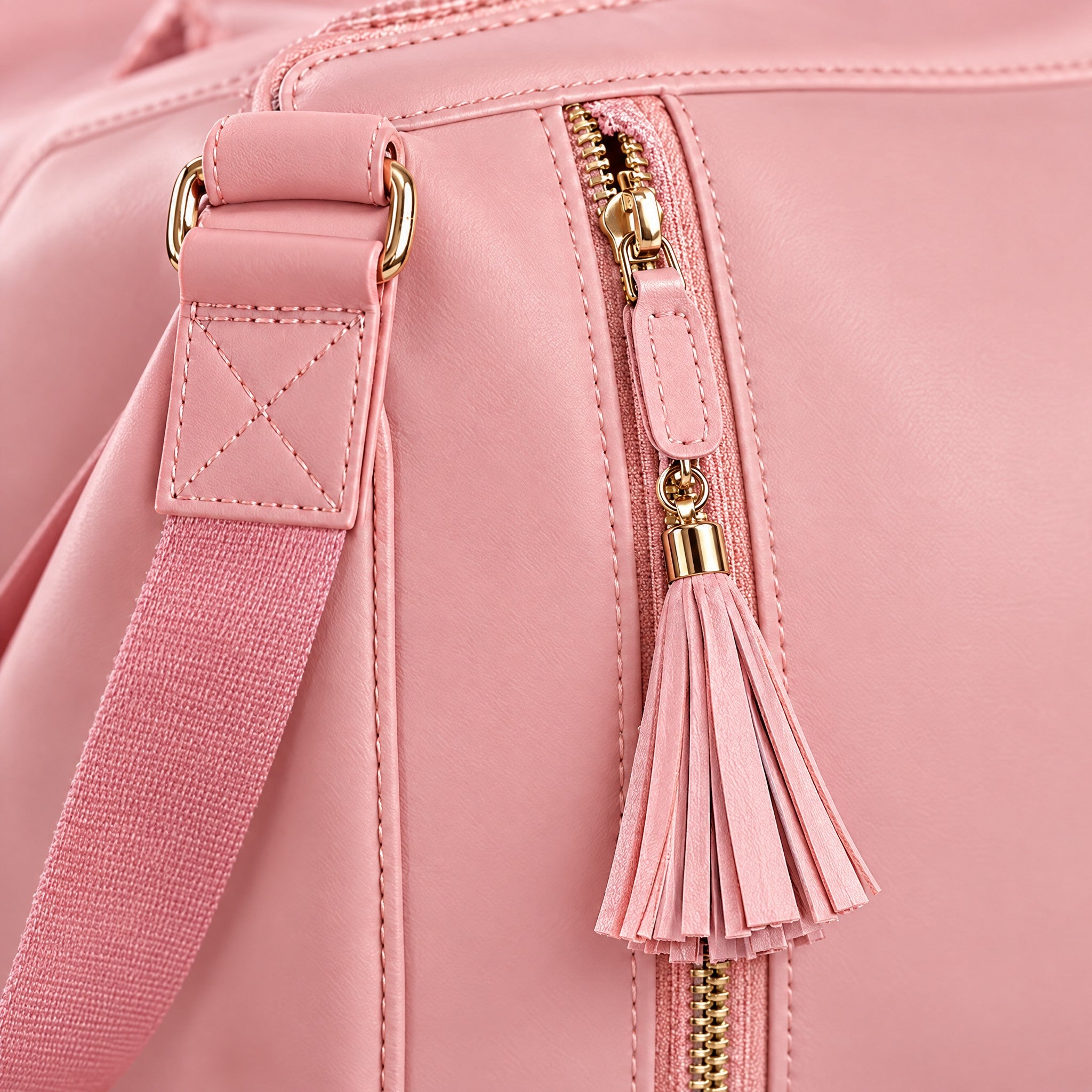 Close-up of the Packlay zipper pull and stitched shoulder strap attachment